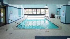 An indoor swimming pool with clear water, a metal ladder, and a sign indicating no diving is allowed. - UPDATED UNIT - Beach Getaway Unit 431 (Myrtle Beach)