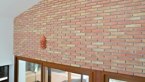 A brick wall with a window below. - Brand New Villa with Private Pool and Lovely Garden near the beach.
 (Alvor)