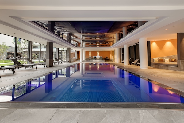Indoor pool, pool umbrellas, pool loungers