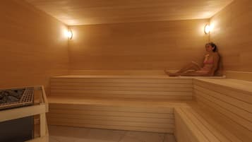 Un sauna avec des bancs en bois et un système de chauffage intégré aux bancs.