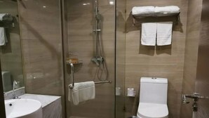 A modern bathroom with a glass-enclosed shower, a white sink, and a toilet. - Jiu Tian Fashion Hotel (Fuzhou)