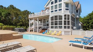 A two-story house with a swimming pool, outdoor seating, and a covered deck. - 7th Heaven: Private Pool, Spa, Game Room (Corolla)