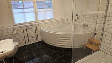 Bathtub, hair dryer, towels, soap