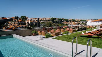 Seasonal outdoor pool, pool umbrellas, pool loungers