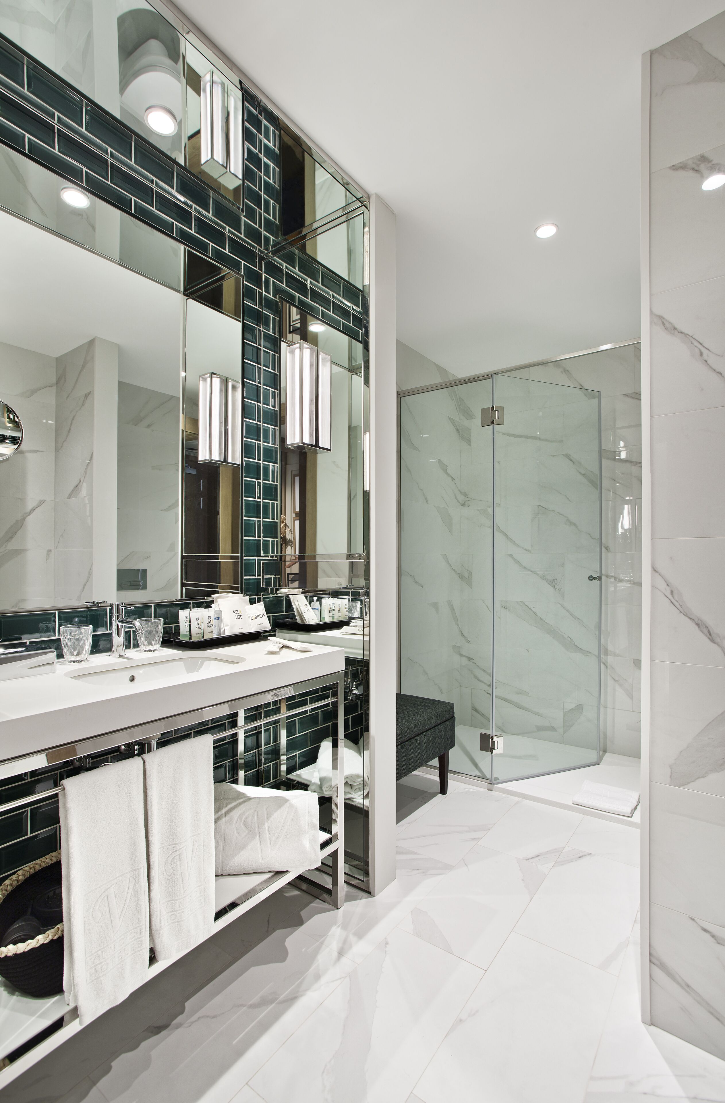 shower, rainfall showerhead, hair dryer, towels