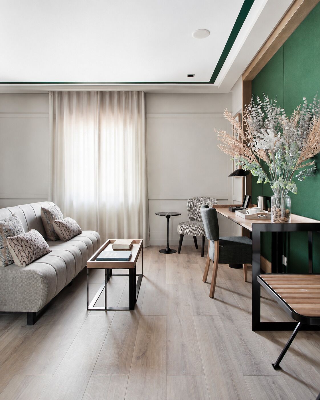 A modern living room with a sofa, coffee table, and a dining area with chairs and a table.