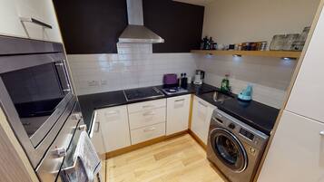 Business Apartment, 2 Bedrooms | Private kitchen | Full-size fridge, microwave, oven, stovetop