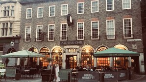 A building with multiple storefronts, including 'All Bar One' and 'Birra Moretti'. - City Heart Brighton (Brighton)