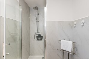 Shower, hair dryer, towels, soap