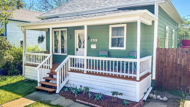 A single-story house with a porch, a front door, and a mailbox. - Charming Centennial Cottage-Downtown! (Rapid City)