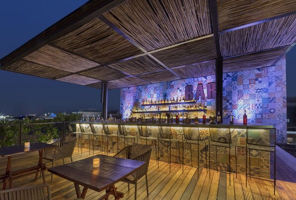 Rooftop bar, pool views, open daily