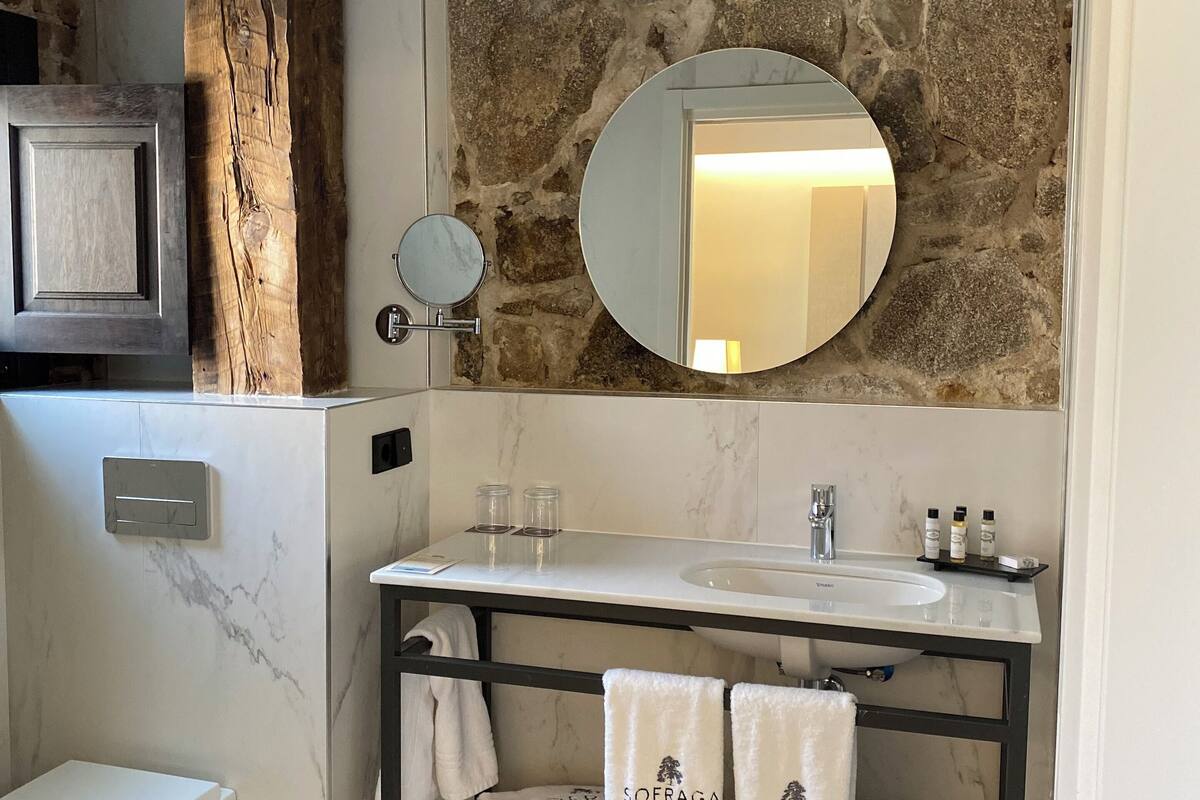 junior suite | bathroom | shower, rainfall showerhead, designer toiletries, hair dryer