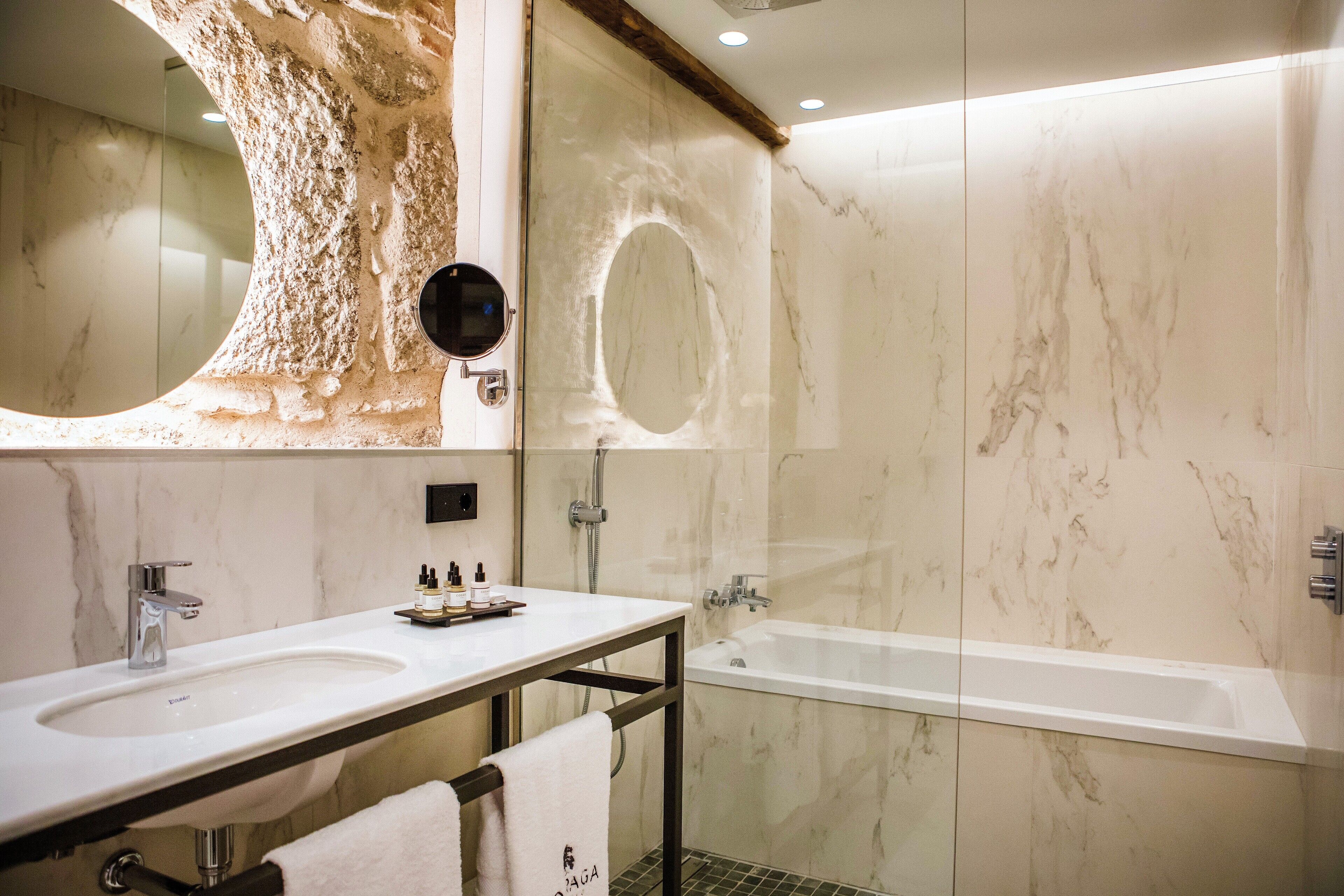 superior suite | bathroom | shower, rainfall showerhead, designer toiletries, hair dryer