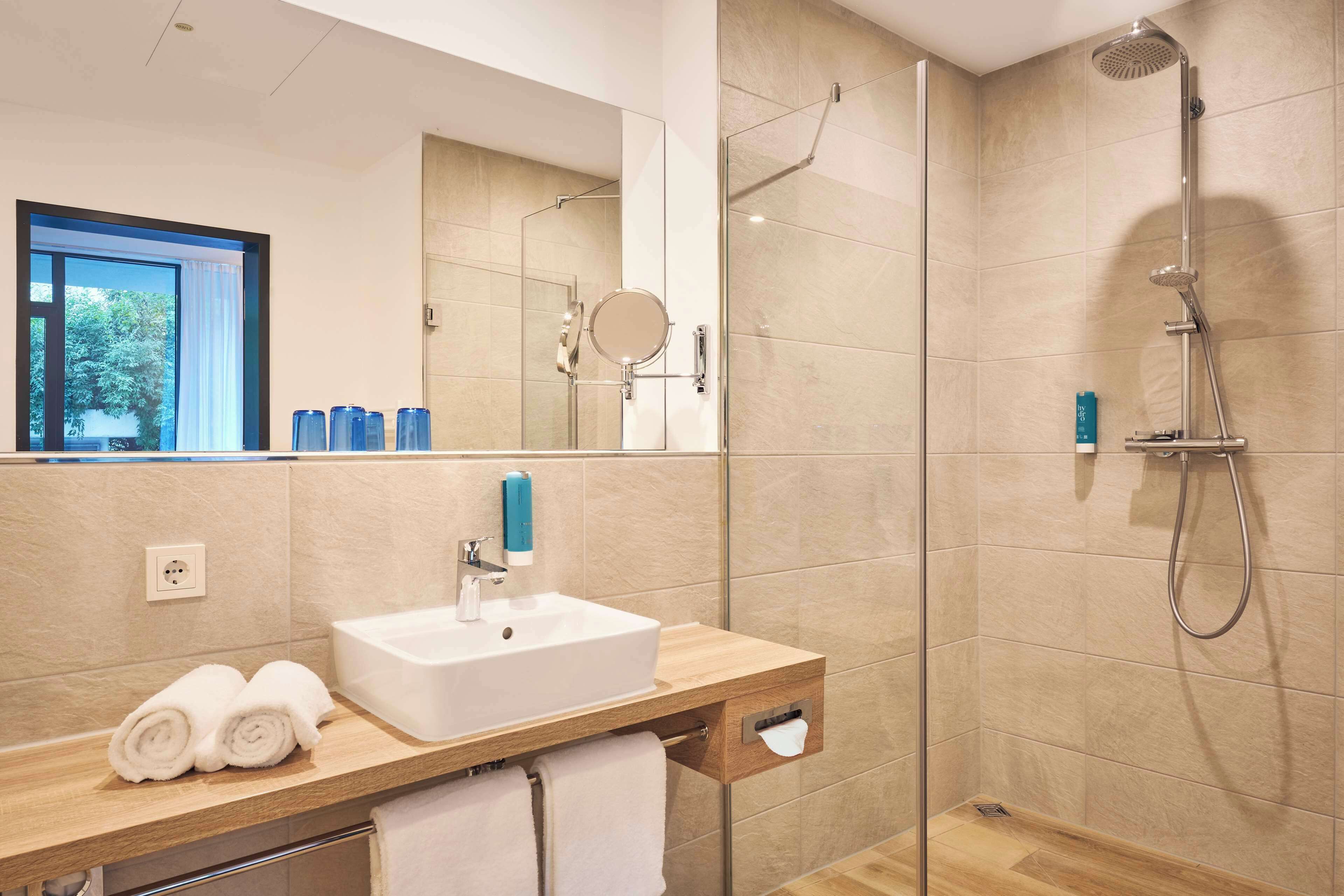 junior room, 1 queen bed, balcony (walk-in shower) | bathroom | shower, hair dryer, towels, soap