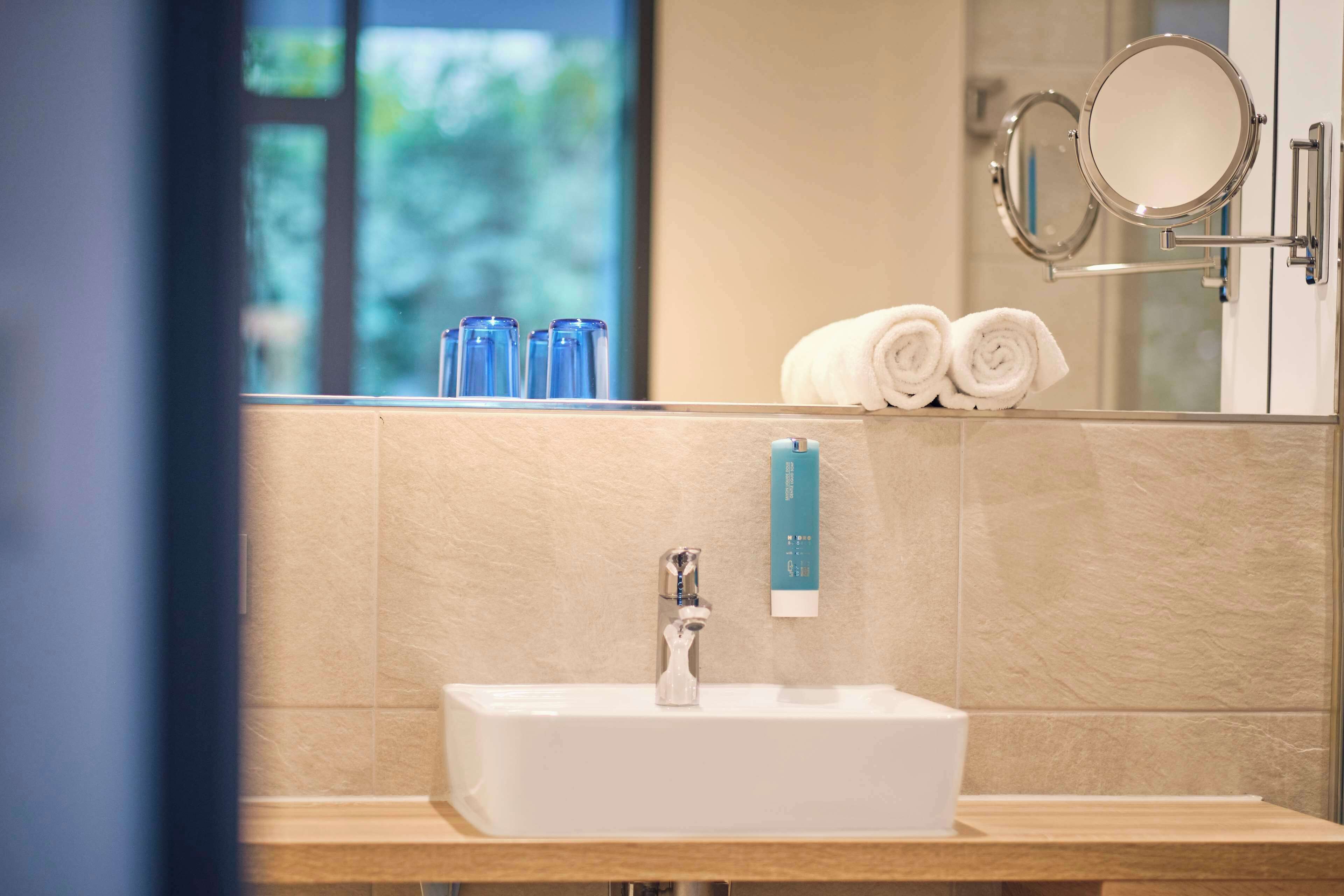 junior room, 1 queen bed, balcony (walk-in shower) | bathroom | shower, hair dryer, towels, soap