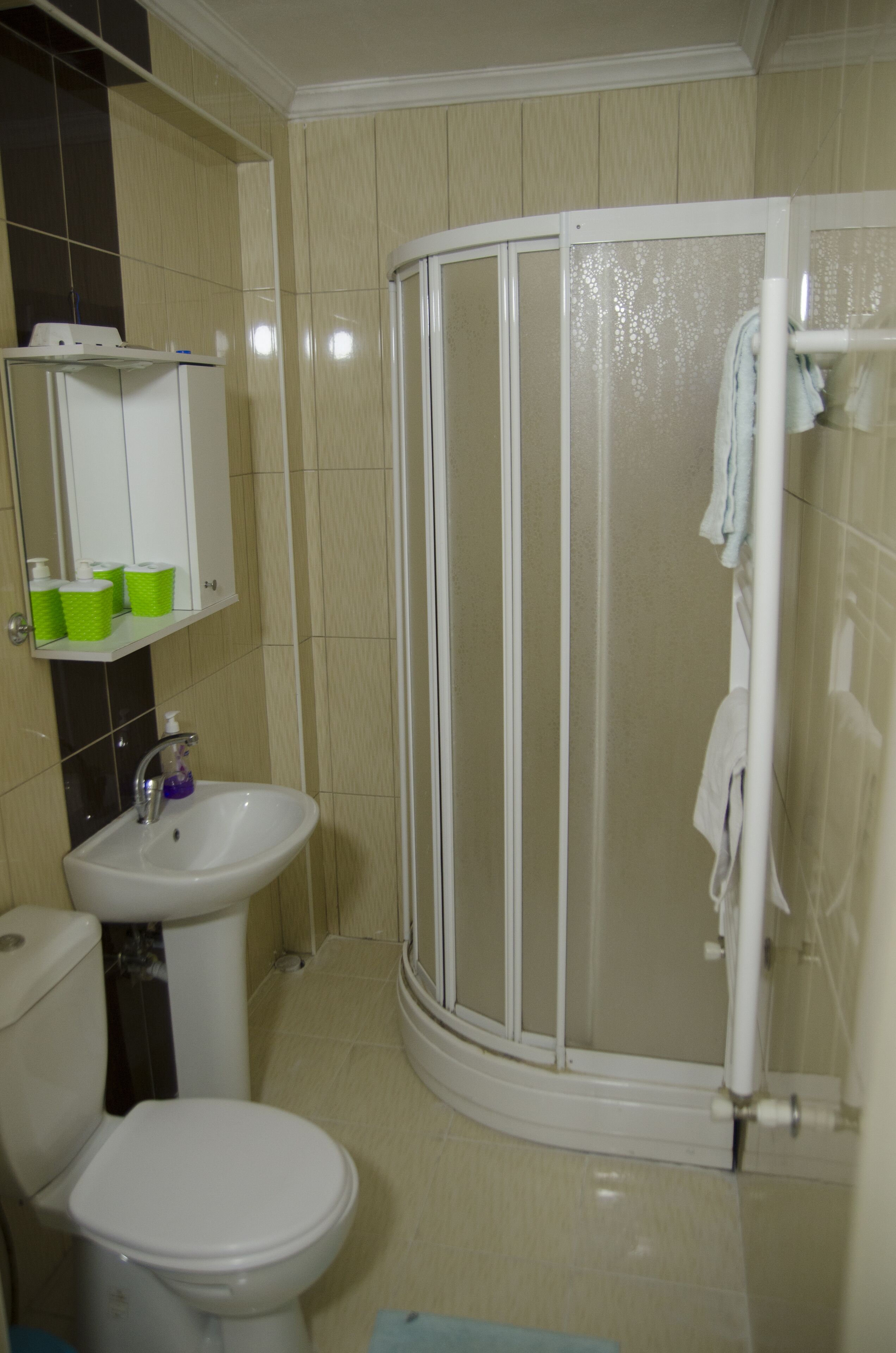 deluxe apartment | bathroom | shower, rainfall showerhead, hair dryer, slippers
