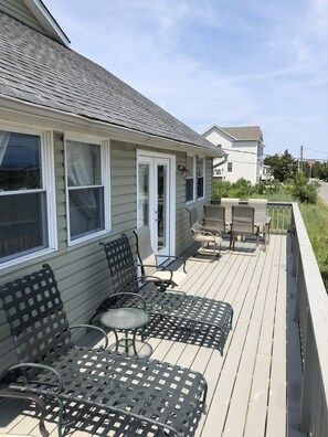 Relax on the deck with comfortable seating and a view of the surrounding neighborhood.