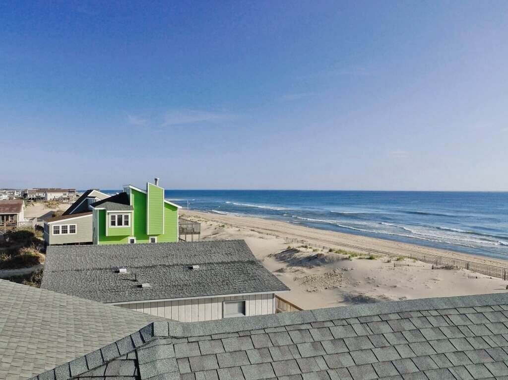 A coastal view with a beach and ocean.