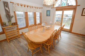 Enjoy meals in this spacious dining room with a large table and comfortable seating for six.
