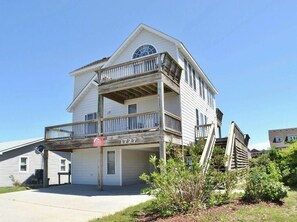 Residents can enjoy a spacious balcony with a railing overlooking the surrounding neighborhood.