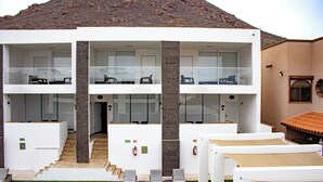 A modern two-story building with a flat roof, large windows, and a staircase leading to the upper floor. - Turquesa 1 Joyas del mar San Carlos (San Carlos)