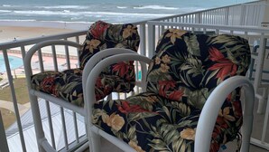 A balcony with a view of the beach and ocean. - DAYTONA GETAWAY OCEAN FRONT CONDO (Daytona Beach)