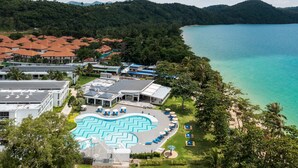 A resort with a swimming pool, beach, and mountainous backdrop. - Royal Yao Yai Island Beach Resort -sha Extra Plus+ (Ko Yao)