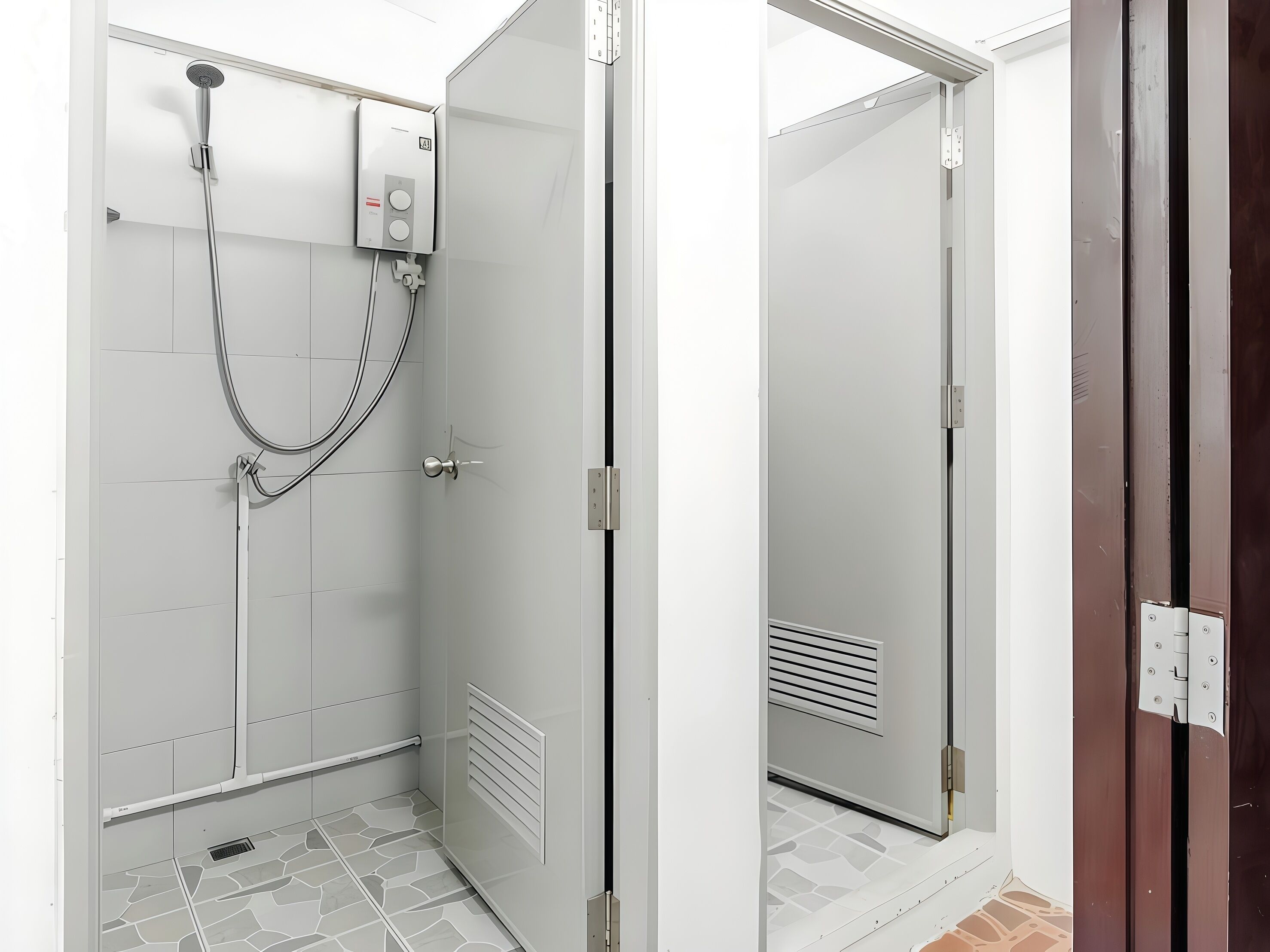 Une salle de bain moderne équipée d’une douche, de toilettes et d’un lavabo.