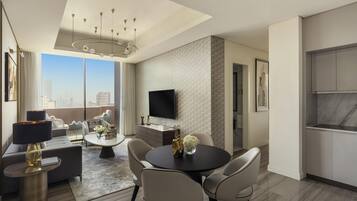 A modern living room with a dining area, a flat-screen TV mounted on the wall, and a large window offering a city view.