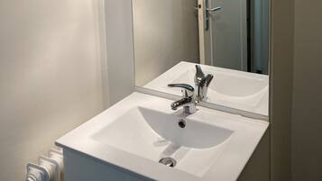 Shower, towels, soap, toilet paper