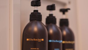 Three shower gel bottles on a shelf. - TORA Hotel Ueno 193 A (Tokyo)