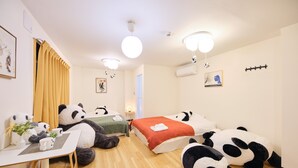A room with a bed, a desk, and panda-themed decorations. - TORA Hotel Ueno 193 A (Tokyo)