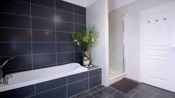 Bathtub, hair dryer, towels, soap