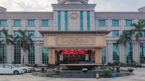 A large building with a central dome and multiple windows. - Dynasty Commercial Hotel (Zhongshan)