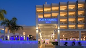 The Oceanis Park Hotel with a modern design, featuring a prominent entrance and multiple balconies. - Oceanis Park Hotel (Rhodes)