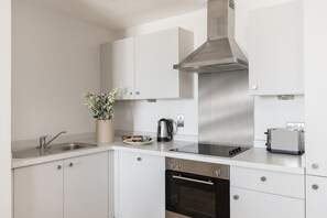 Apartament, 1 dormitori | Cuina privada | Frigorífic, microones, forn i placa de cuina 