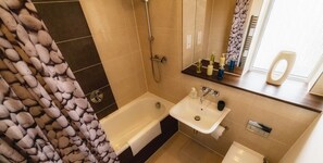 Comfort House | Bathroom | Hair dryer, soap, shampoo, toilet paper