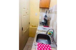 Fridge, microwave, stovetop, coffee/tea maker