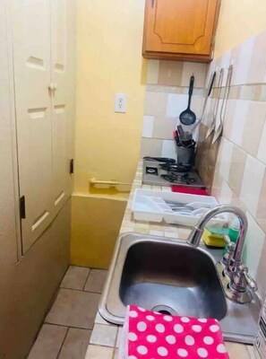 Fridge, microwave, stovetop, coffee/tea maker