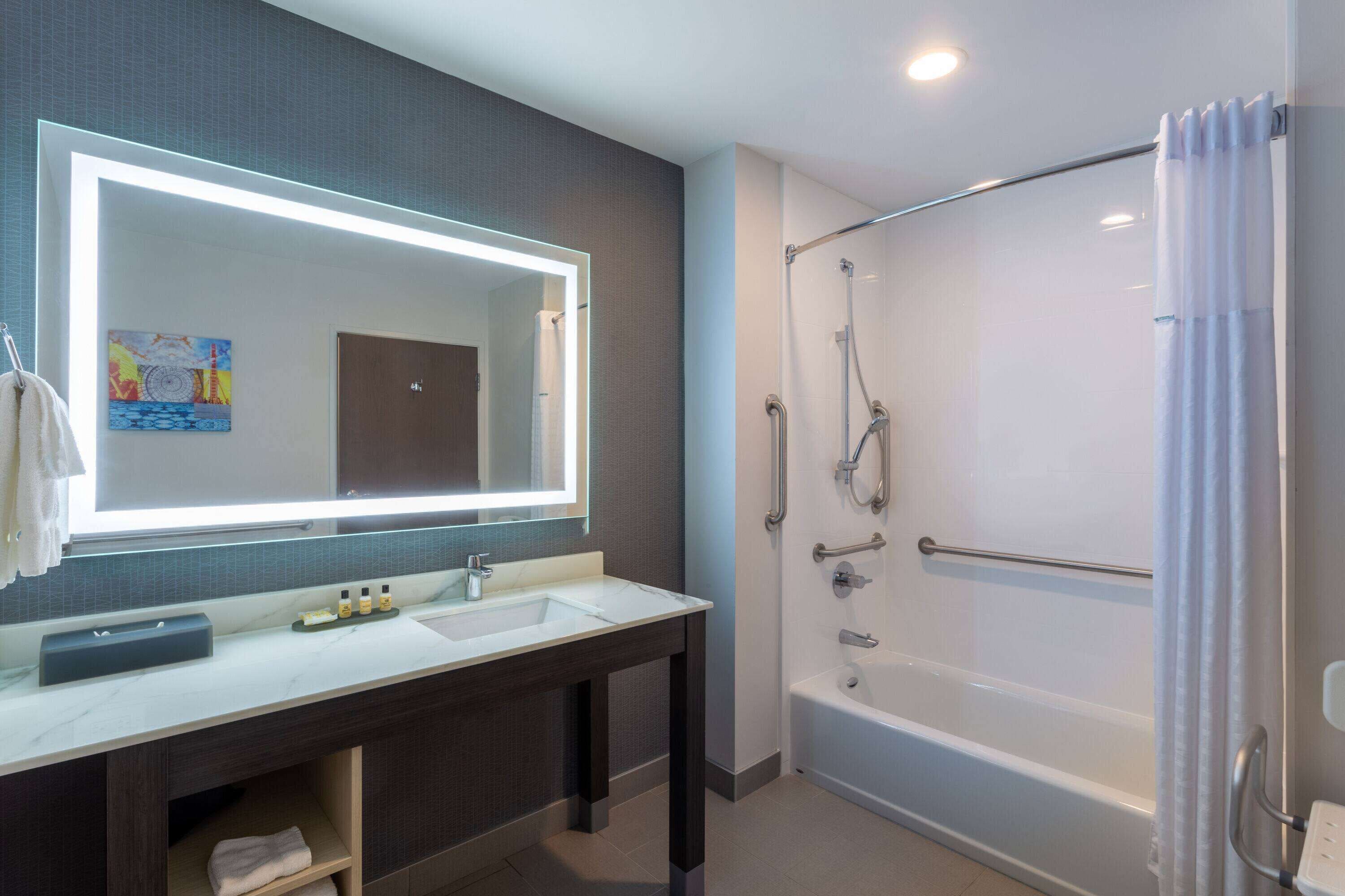 room, 1 king bed, accessible, non smoking (mobility,tub w/grab bars) | bathroom | free toiletries, hair dryer, towels