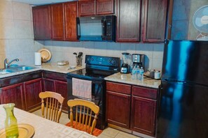 Fridge, microwave, stovetop, coffee/tea maker