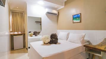 Quarto casal standard | Frigobar, roupa de cama