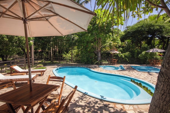 4 outdoor pools, open 9:00 AM to 10:00 PM, pool loungers