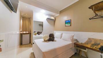 Quarto casal standard | Frigobar, roupa de cama