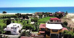 A coastal resort with multiple villas, a beach, and a golf course. - Nirvana Club Village (Belcastro)