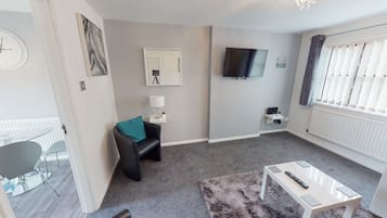 Business House | Living area | Flat-screen TV