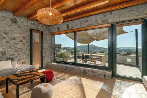 Deluxe Suite | Living area | 65-inch flat-screen TV with cable channels, Smart TV - Petra Residence Mini Pool Spa (Milos)