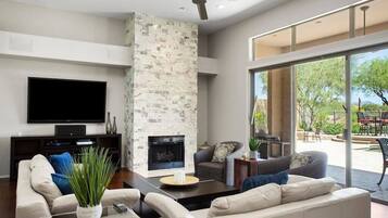 TV, fireplace, books