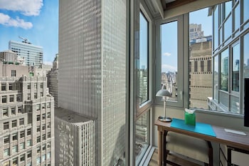 Hypo-allergenic bedding, in-room safe, desk, laptop workspace at Margaritaville Resort Times Square