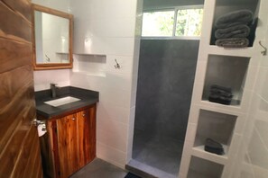 Shower, towels, soap, toilet paper